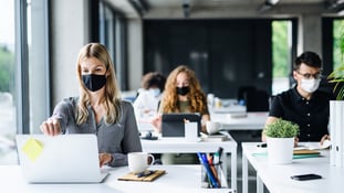 Office workers with face masks